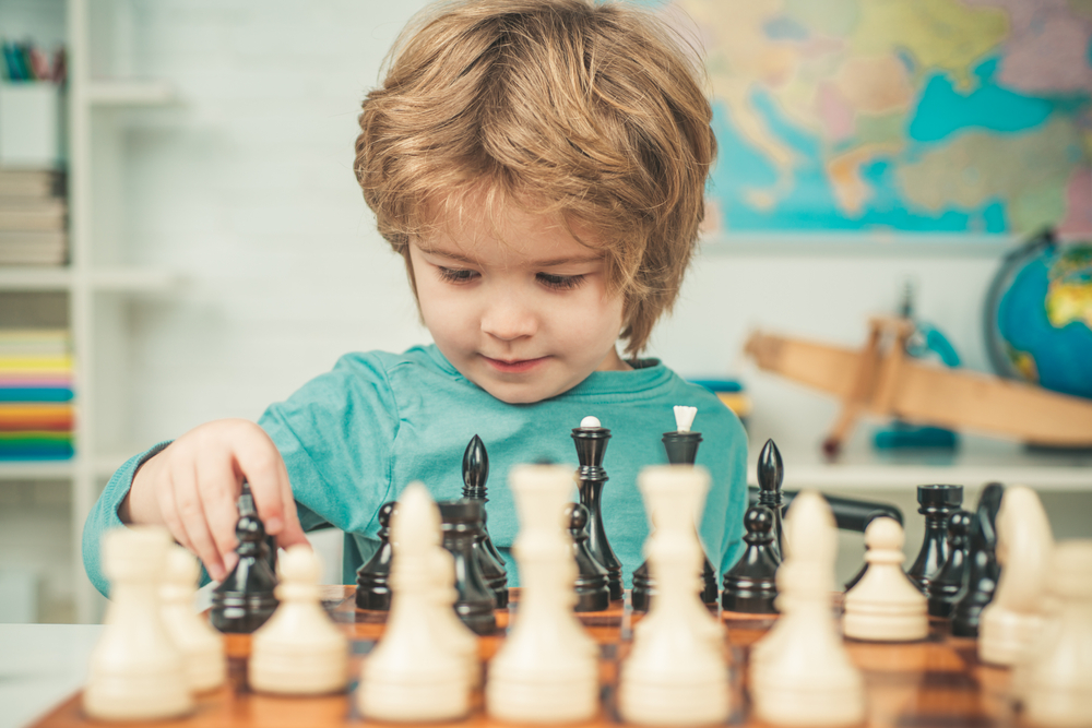 A child beginning their quest for chess learning and improvement