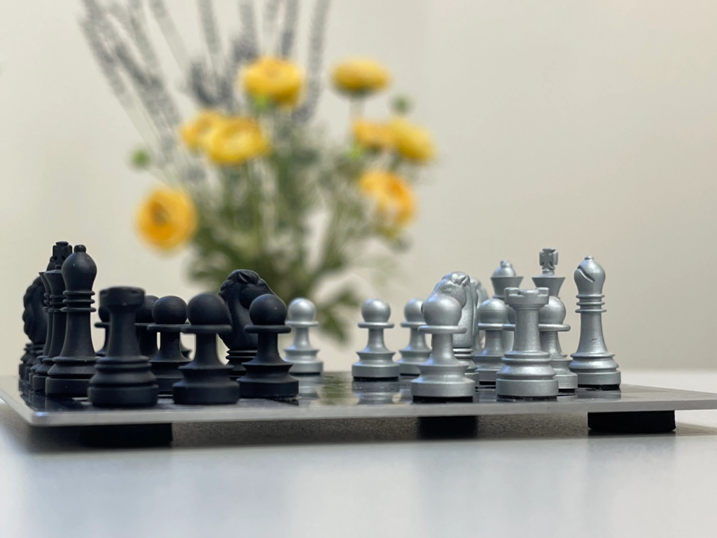 A photo of a chessboard with pieces set up for a new game, inviting the reader to learn more about chess and mental health.
