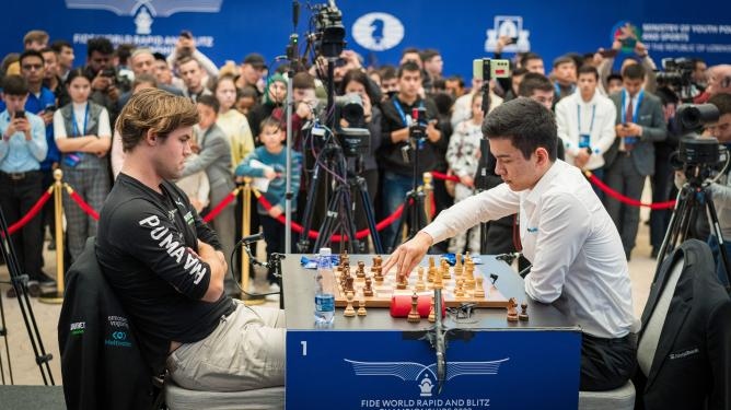 Abdusattorov vs. Carlsen from the 2023 FIDE World Rapid Championship. Photo: Lennart Ootes/FIDE.