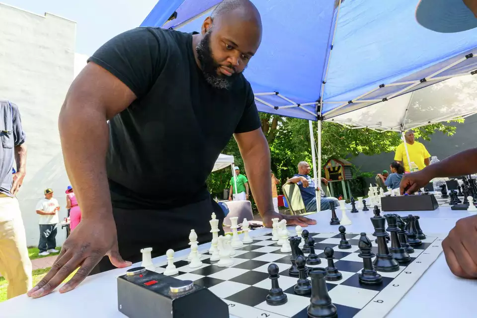 Phil Thomas, the first Black national chess master from the Capital Region, plays eight games simultaneously during the sixth annual Chess Peace Day on Saturday, Aug. 24, 2024, at Malcolm X Community Park in Albany. The event is held to promote chess as an alternative to violence in the community.Jim Franco/Times Union