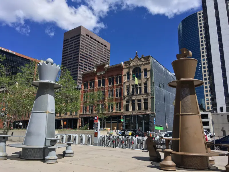 Chess tables in Downtown Denver Colorado. Themed Tables for Outdoor chess Players , outdoor , Sunny Blue Sky, City